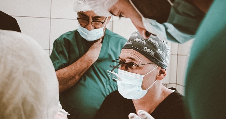 Hair transplant doctors discussing a successful operation